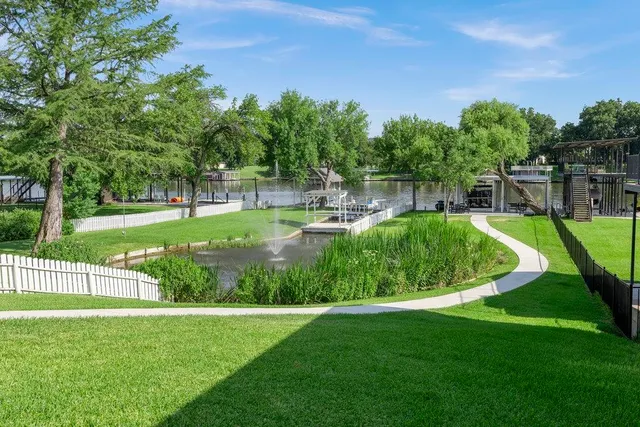 a view of a backyard with swimming pool