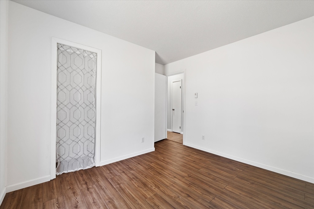 359 Bemis Road Warren, MA 01585 - Photo 20 of 27 a view of an empty room with wooden floor