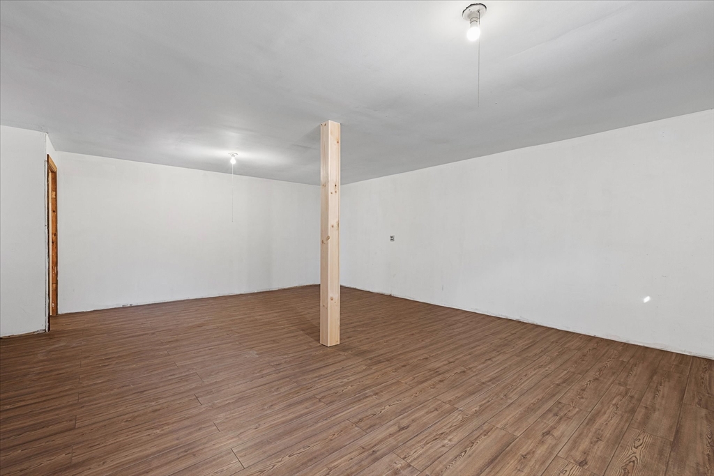 359 Bemis Road Warren, MA 01585 - Photo 26 of 27 a view of an empty room with wooden floor