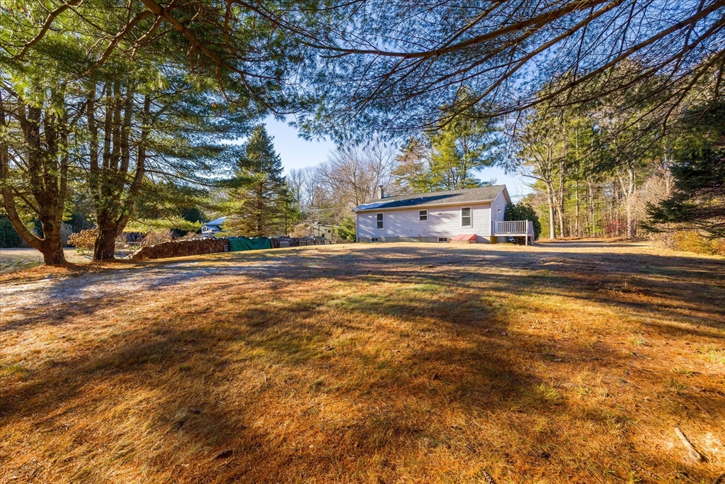 359 Bemis Road Warren, MA 01585 - Photo 7 of 27 a view of a house with a yard
