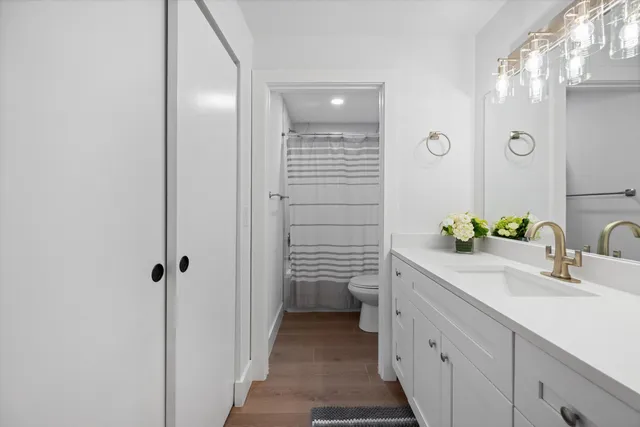 a bathroom with a sink a vanity and a mirror