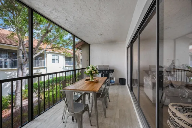 a outdoor dining space with furniture and outdoor view