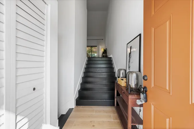 a view of entryway and hall with wooden floor