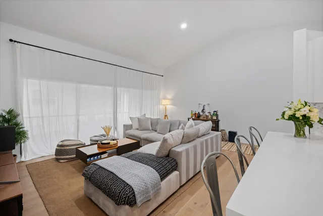 a bedroom with furniture and a potted plant