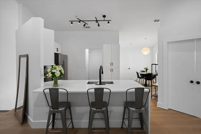 a view of a dining room with furniture and wooden floor