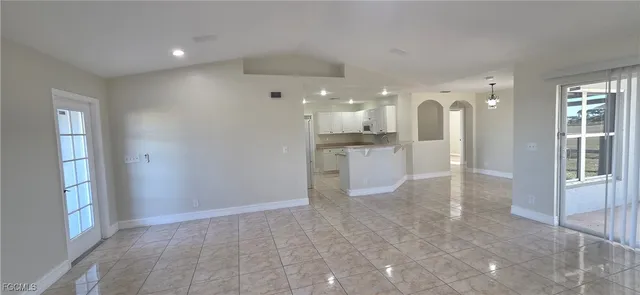 a view of a kitchen with a sink and cabinets