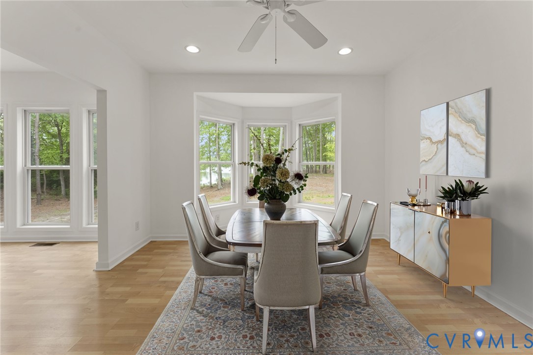 625 Whispering Pines Road Lancaster, VA 22503 - Photo 14 of 71 a view of a dining room with furniture window and outside view