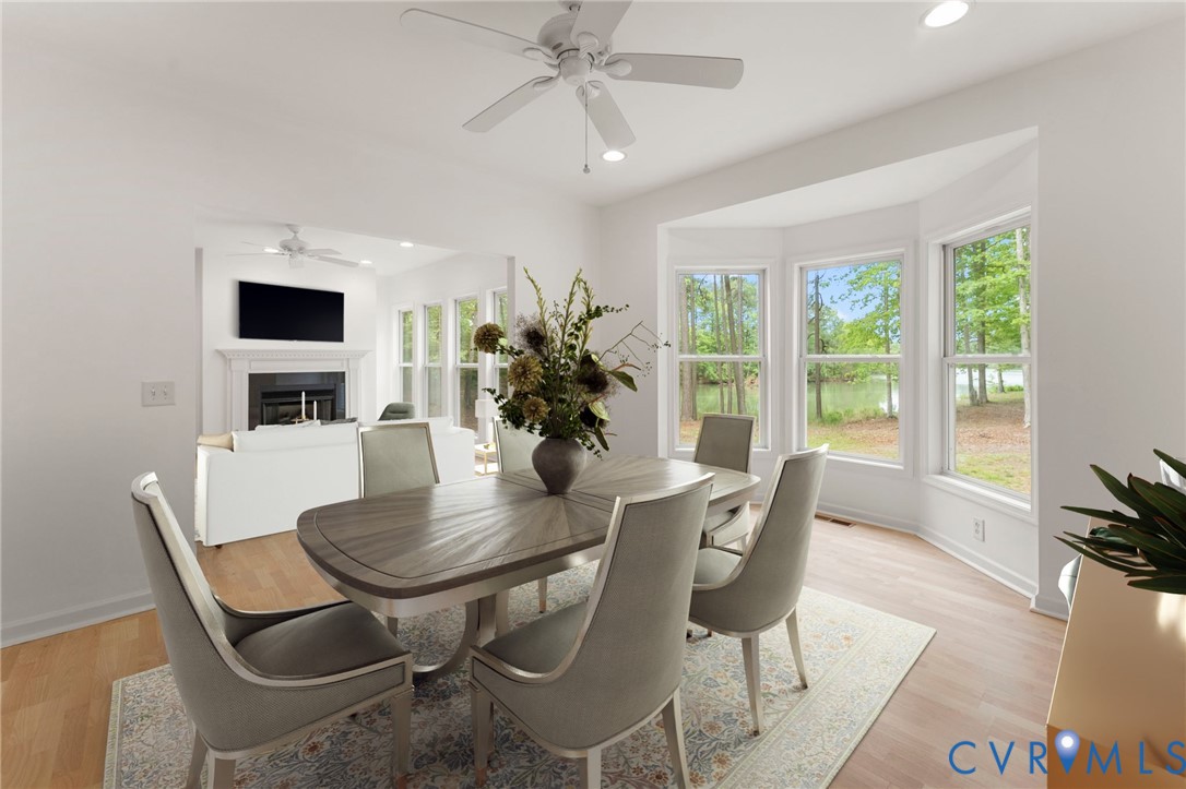 625 Whispering Pines Road Lancaster, VA 22503 - Photo 16 of 71 a dining room with furniture and window