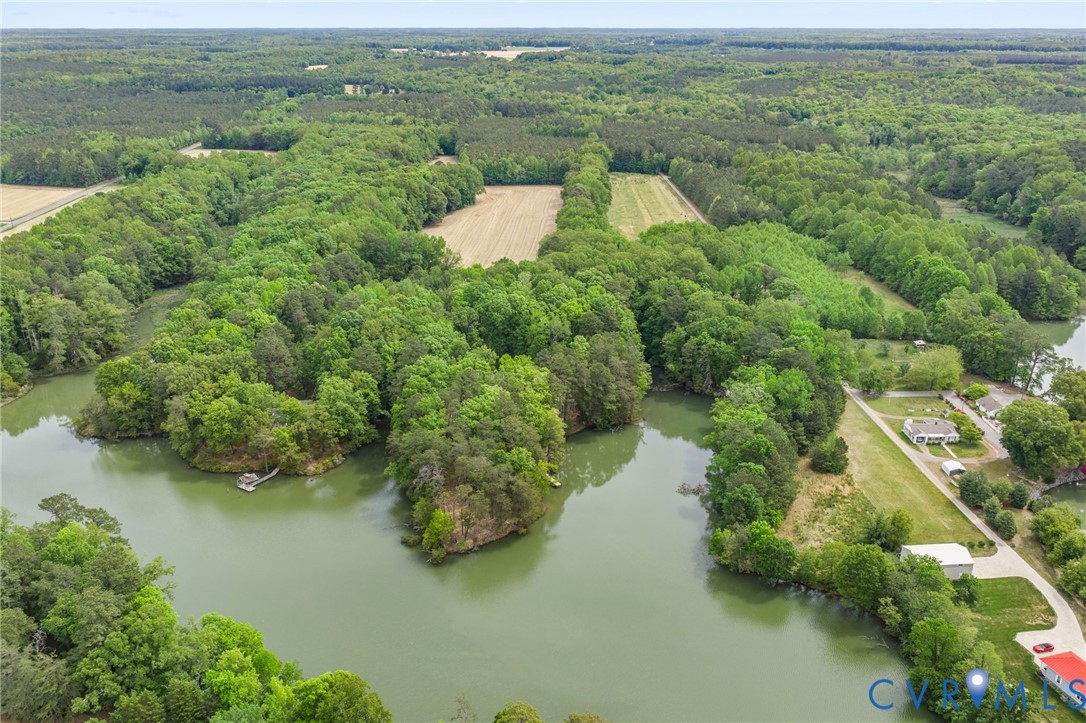 625 Whispering Pines Road Lancaster, VA 22503 - Photo 2 of 71 an aerial view of a houses with outdoor space and trees