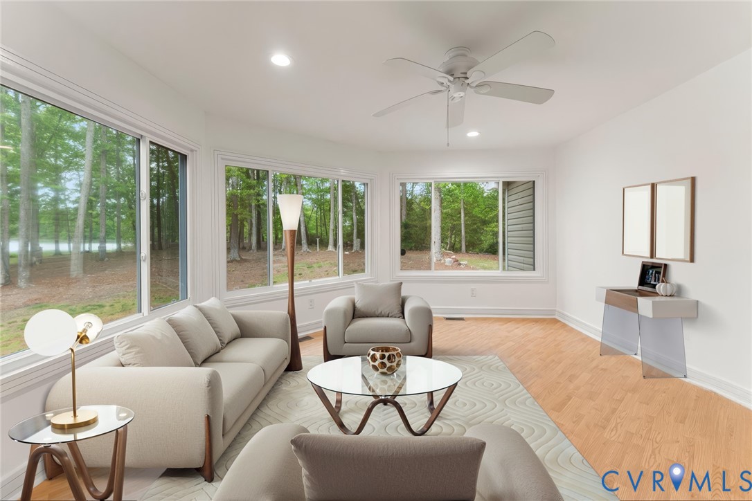 625 Whispering Pines Road Lancaster, VA 22503 - Photo 24 of 71 a living room with furniture and a large window