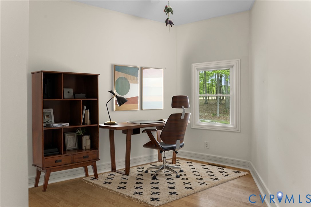 625 Whispering Pines Road Lancaster, VA 22503 - Photo 28 of 71 a view of a workspace with furniture and a window