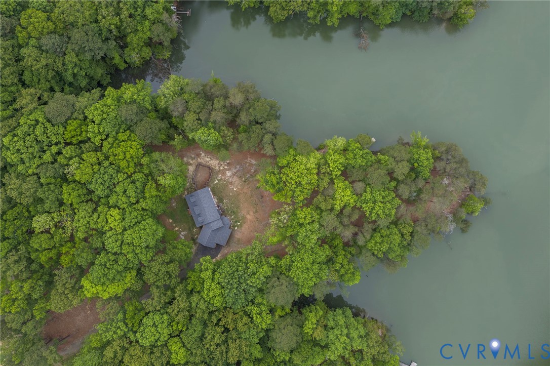 625 Whispering Pines Road Lancaster, VA 22503 - Photo 3 of 71 an aerial view of a house with a yard and lake view