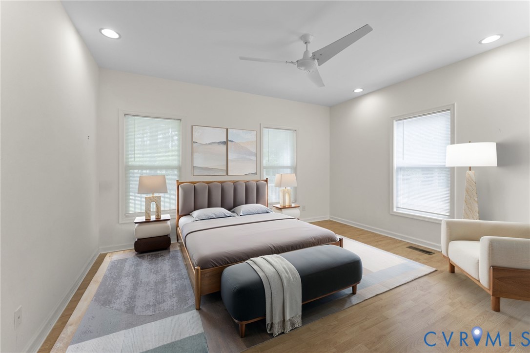 625 Whispering Pines Road Lancaster, VA 22503 - Photo 32 of 71 a bedroom with a bed and a couch