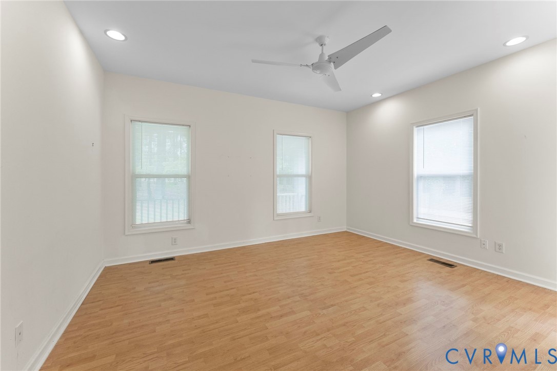 625 Whispering Pines Road Lancaster, VA 22503 - Photo 33 of 71 an empty room with windows and closet
