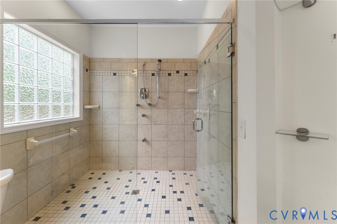 625 Whispering Pines Road Lancaster, VA 22503 - Photo 37 of 71 a bathroom with a shower