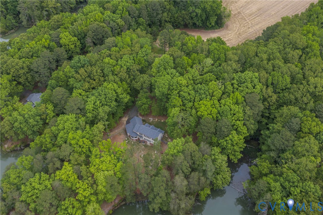 625 Whispering Pines Road Lancaster, VA 22503 - Photo 5 of 71 an aerial view of a house with a yard