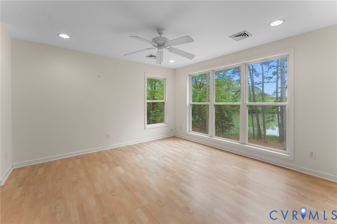 625 Whispering Pines Road Lancaster, VA 22503 - Photo 51 of 71 an empty room with windows and closet