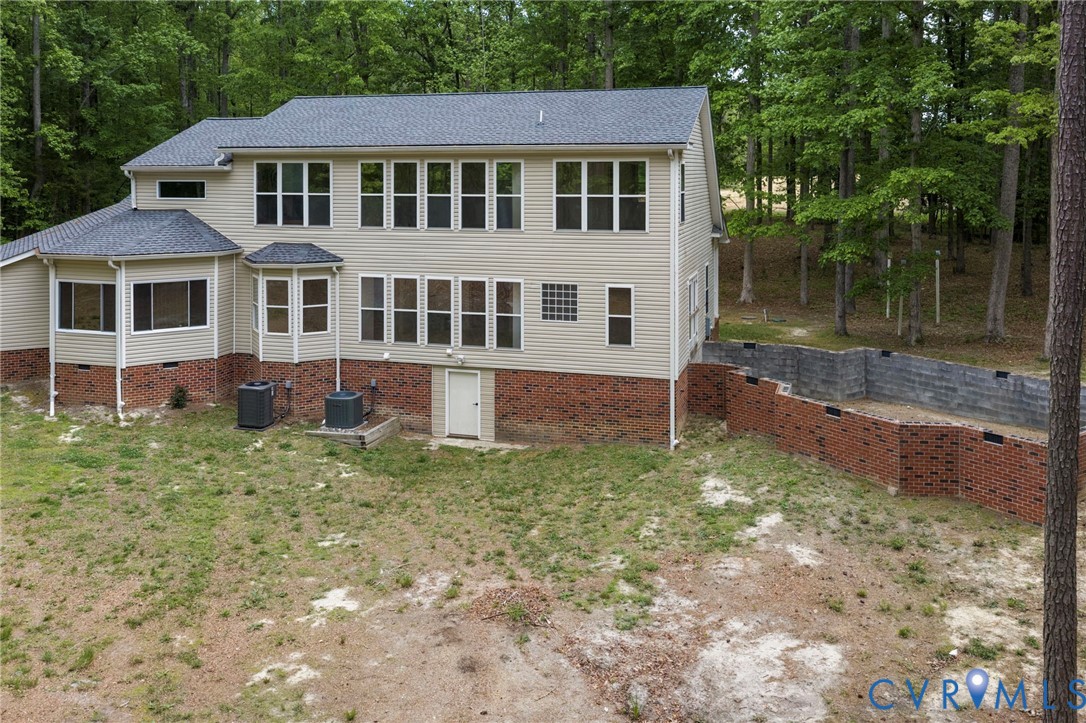 625 Whispering Pines Road Lancaster, VA 22503 - Photo 60 of 71 a front view of a house with a yard