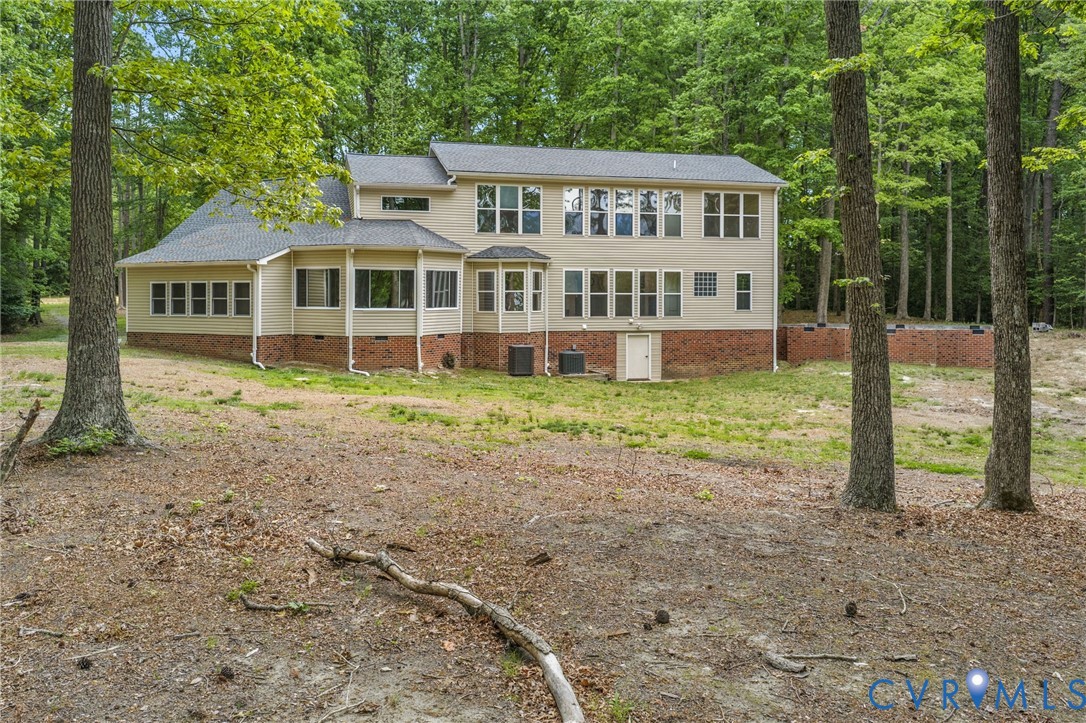 625 Whispering Pines Road Lancaster, VA 22503 - Photo 61 of 71 a view of a house with backyard and a tree