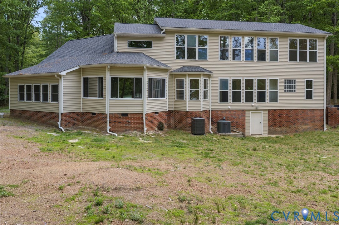 625 Whispering Pines Road Lancaster, VA 22503 - Photo 62 of 71 a front view of a house with a yard