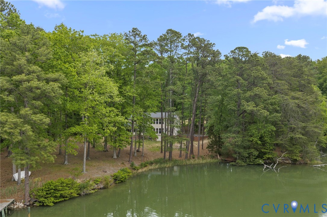 625 Whispering Pines Road Lancaster, VA 22503 - Photo 63 of 71 a view of a lake with houses in the back