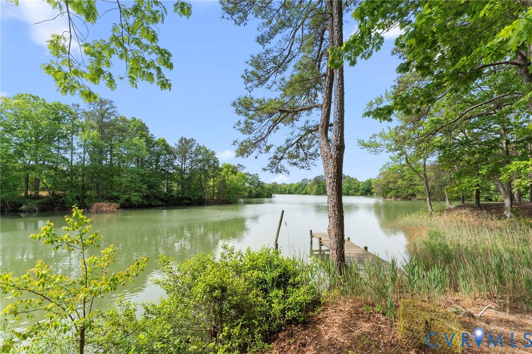 625 Whispering Pines Road Lancaster, VA 22503 - Photo 66 of 71 a view of a lake with a large trees