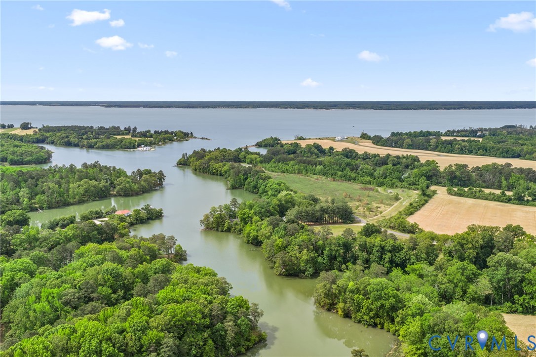 625 Whispering Pines Road Lancaster, VA 22503 - Photo 69 of 71 an aerial view of ocean with residential houses with outdoor space and trees