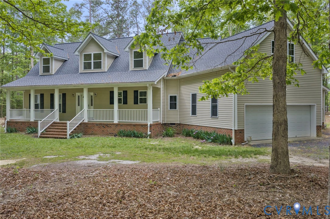 625 Whispering Pines Road Lancaster, VA 22503 - Photo 71 of 71 a front view of a house with a yard