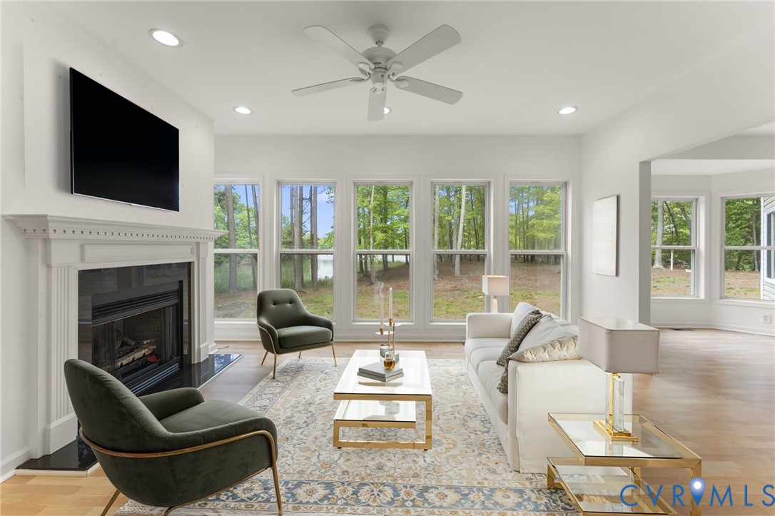 625 Whispering Pines Road Lancaster, VA 22503 - Photo 8 of 71 a living room with furniture fireplace and flat screen tv