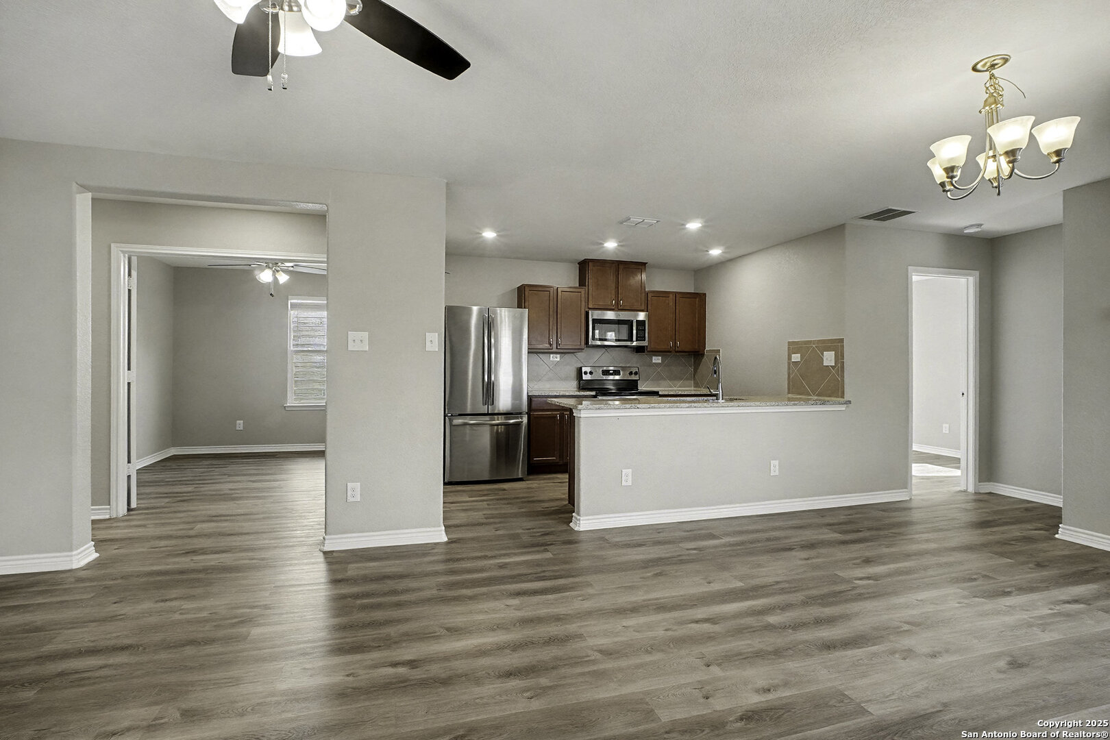 6508 Buffalo Ranch San Antonio, TX 78244 - Photo 11 of 31 a view of kitchen with cabinets appliances and wooden floor
