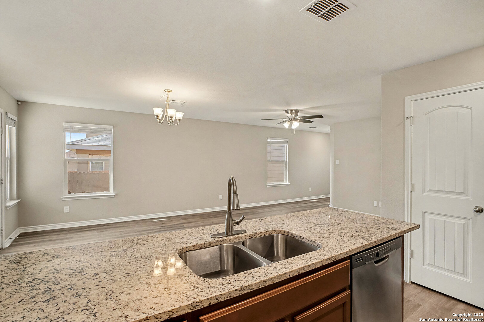 6508 Buffalo Ranch San Antonio, TX 78244 - Photo 14 of 31 a kitchen with a sink and chandelier