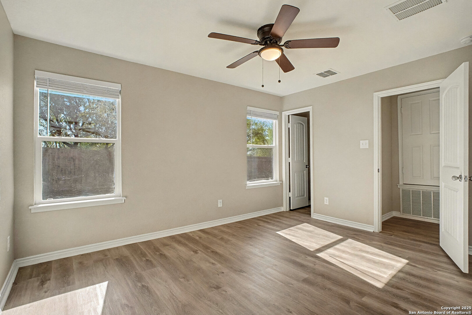 6508 Buffalo Ranch San Antonio, TX 78244 - Photo 17 of 31 a view of empty room with wooden floor and window