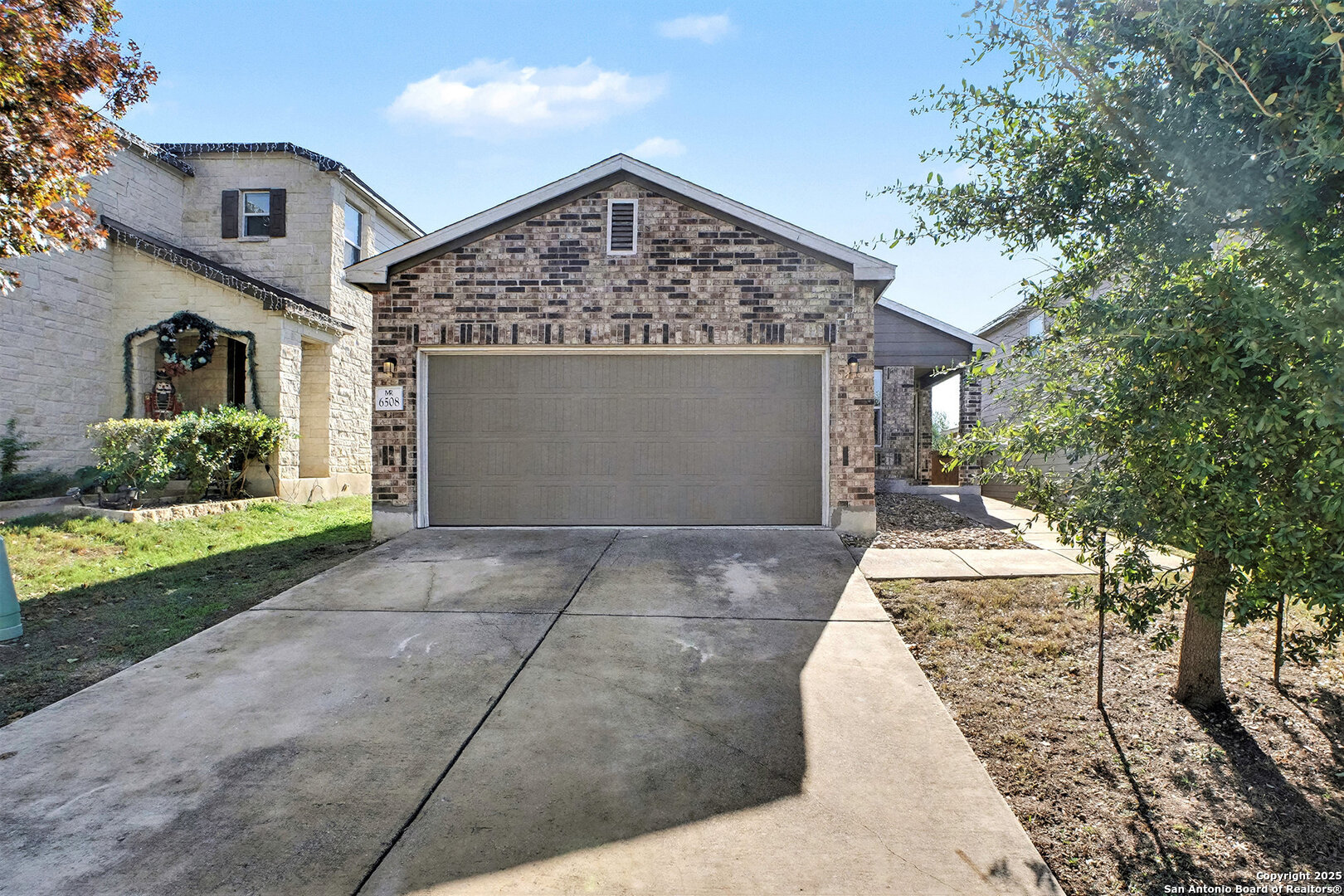 6508 Buffalo Ranch San Antonio, TX 78244 - Photo 2 of 31 a front view of a house with garden