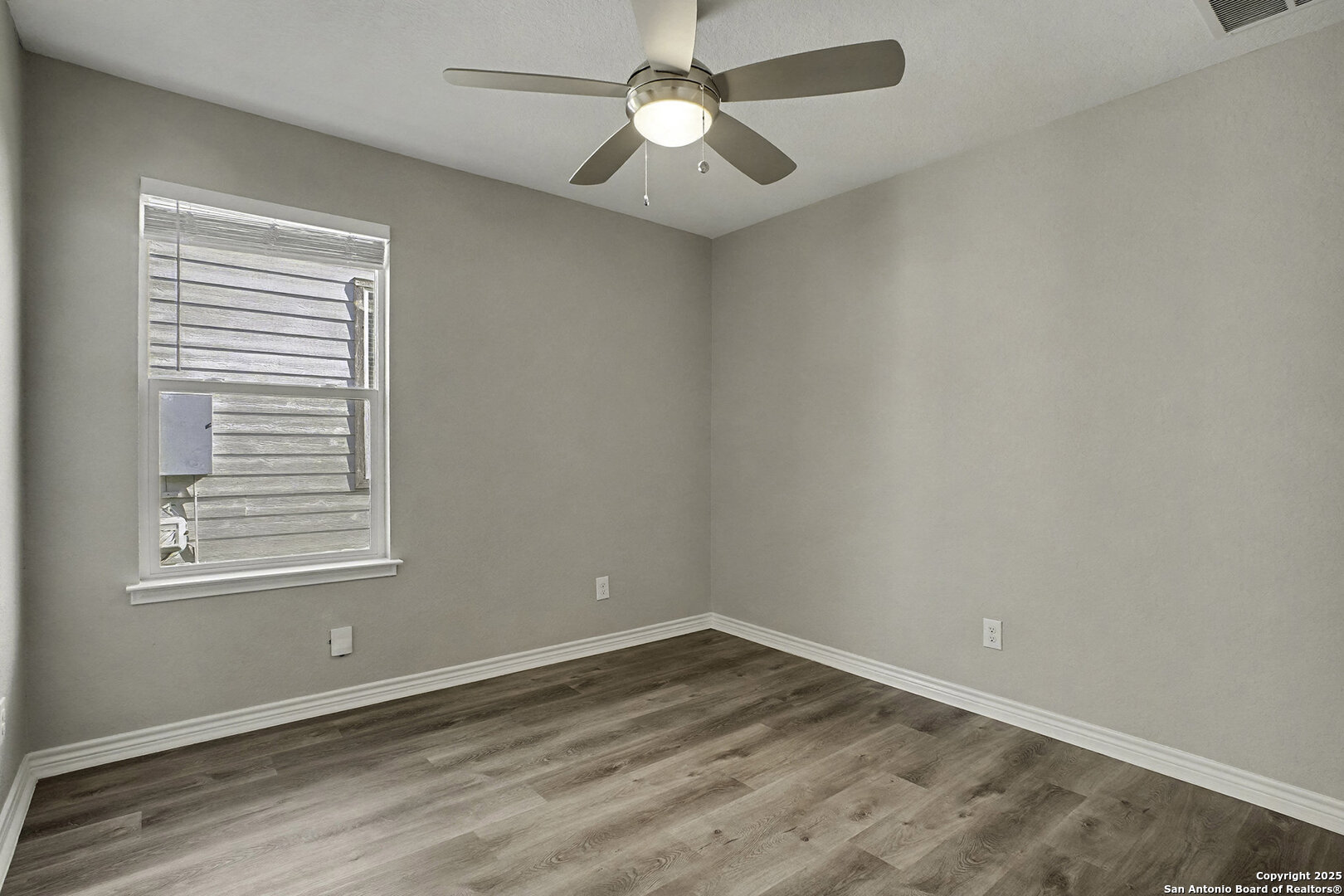 6508 Buffalo Ranch San Antonio, TX 78244 - Photo 24 of 31 a view of empty room with wooden floor and fan