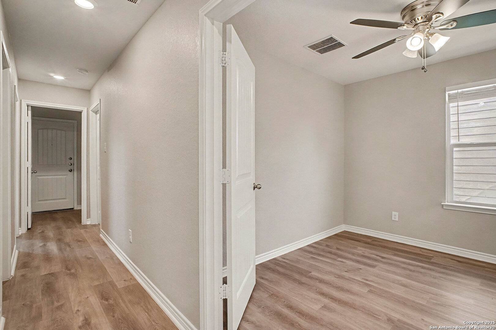 6508 Buffalo Ranch San Antonio, TX 78244 - Photo 26 of 31 a view of hallway with window and wooden floor
