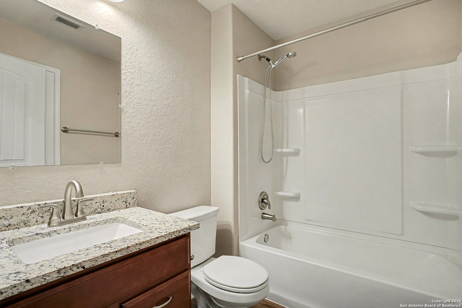 6508 Buffalo Ranch San Antonio, TX 78244 - Photo 27 of 31 a bathroom with a granite countertop sink toilet and shower