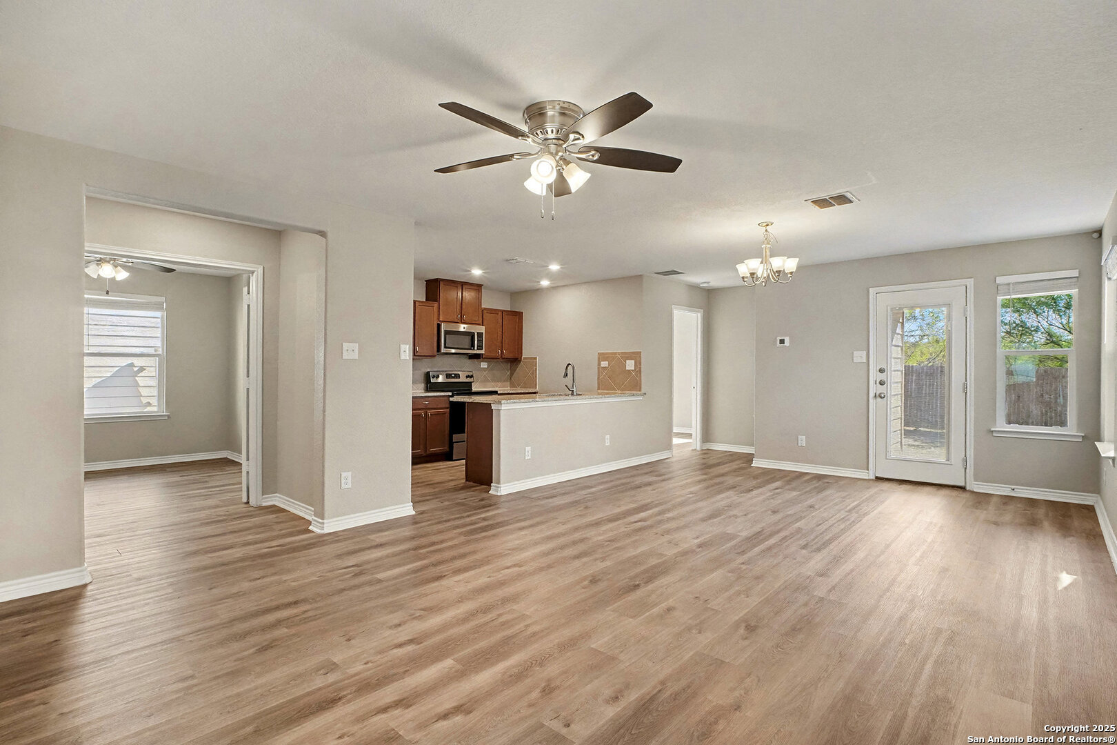 6508 Buffalo Ranch San Antonio, TX 78244 - Photo 8 of 31 a view of an empty room and wooden floor