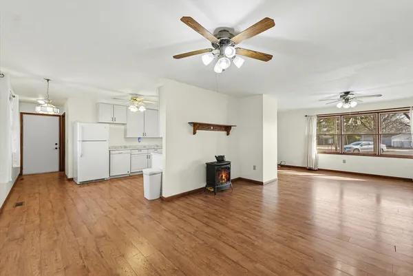 a view of a kitchen with a sink and a refrigerator