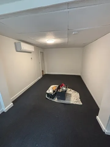 an empty room with a fireplace