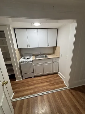 a view of a kitchen with sink and dishwasher