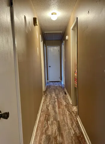 a view of hallway with a mirror