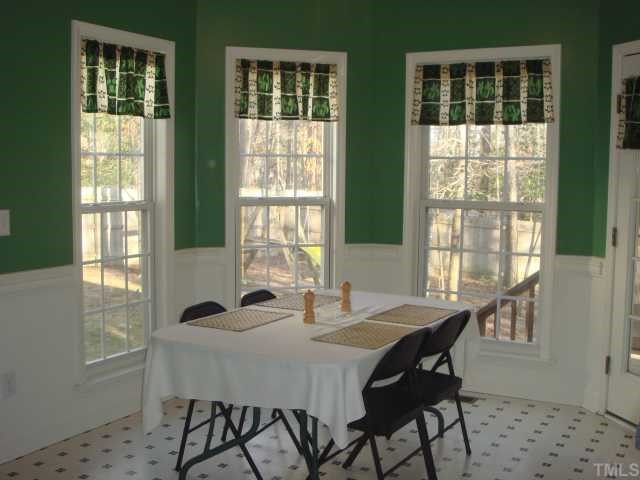 3620 Dewing Drive Raleigh, NC 27616 - Photo 7 of 12 Breakfast area overlooks the fenced in rear yard and play set.