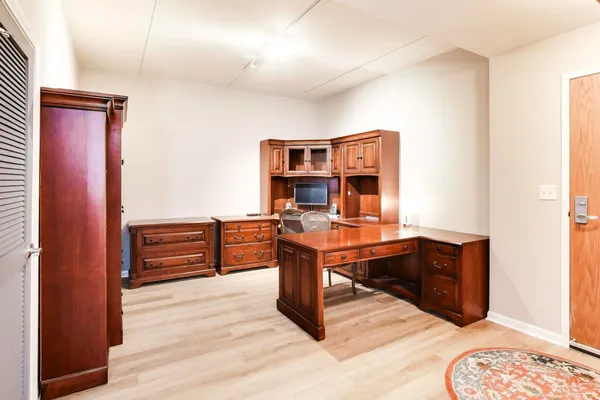 a view of a workspace with furniture