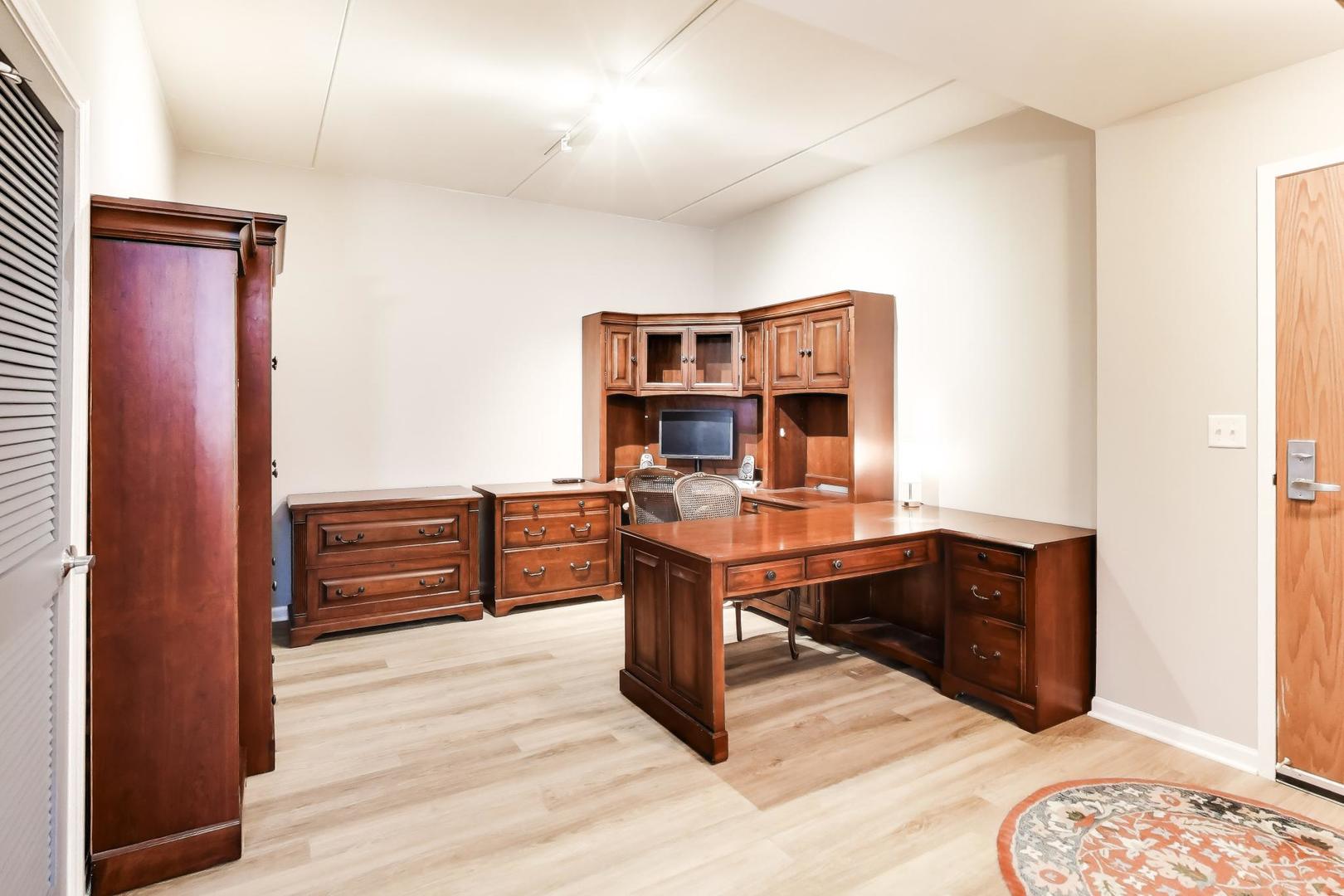 1199 East Port Clinton Road, Unit 311 Vernon Hills, IL 60061 - Photo 9 of 23 a view of a workspace with furniture