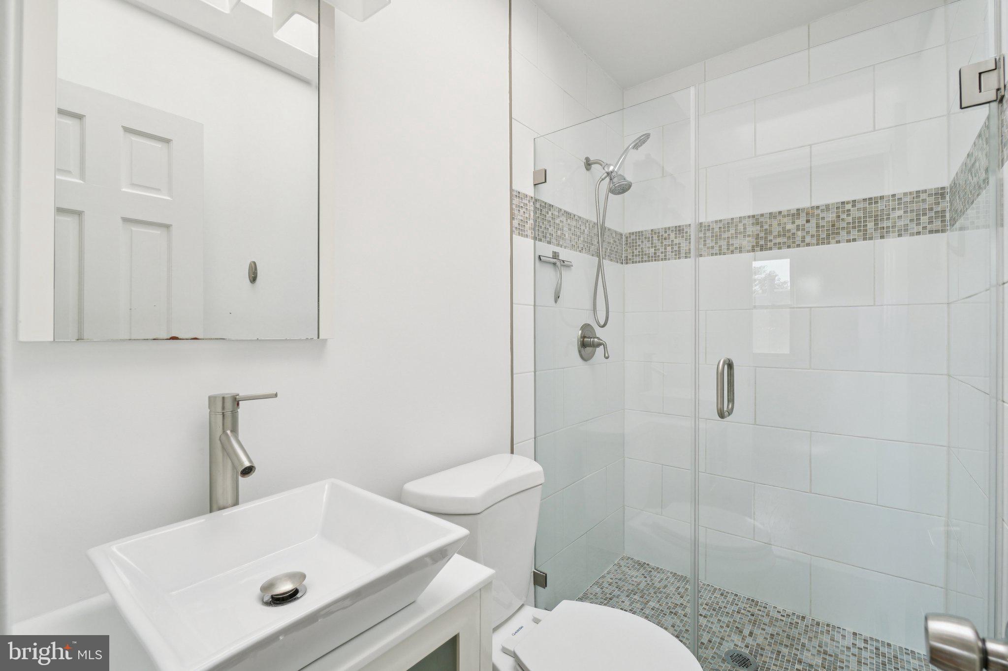 624 19th Street Northeast Washington, DC 20002 - Photo 18 of 29 a bathroom with a sink toilet and shower