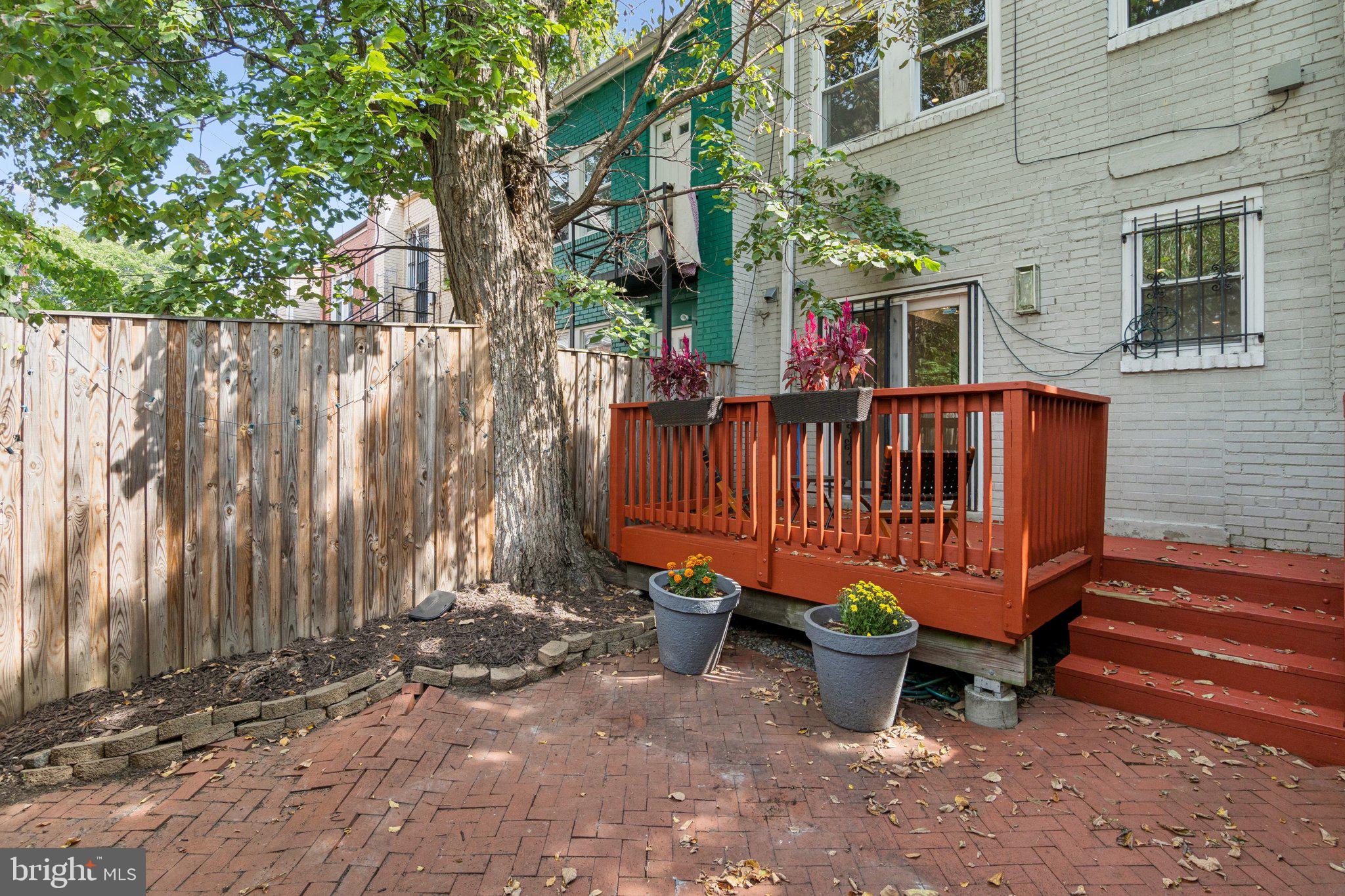 624 19th Street Northeast Washington, DC 20002 - Photo 28 of 29 a view of a backyard with a sitting area and wooden fence