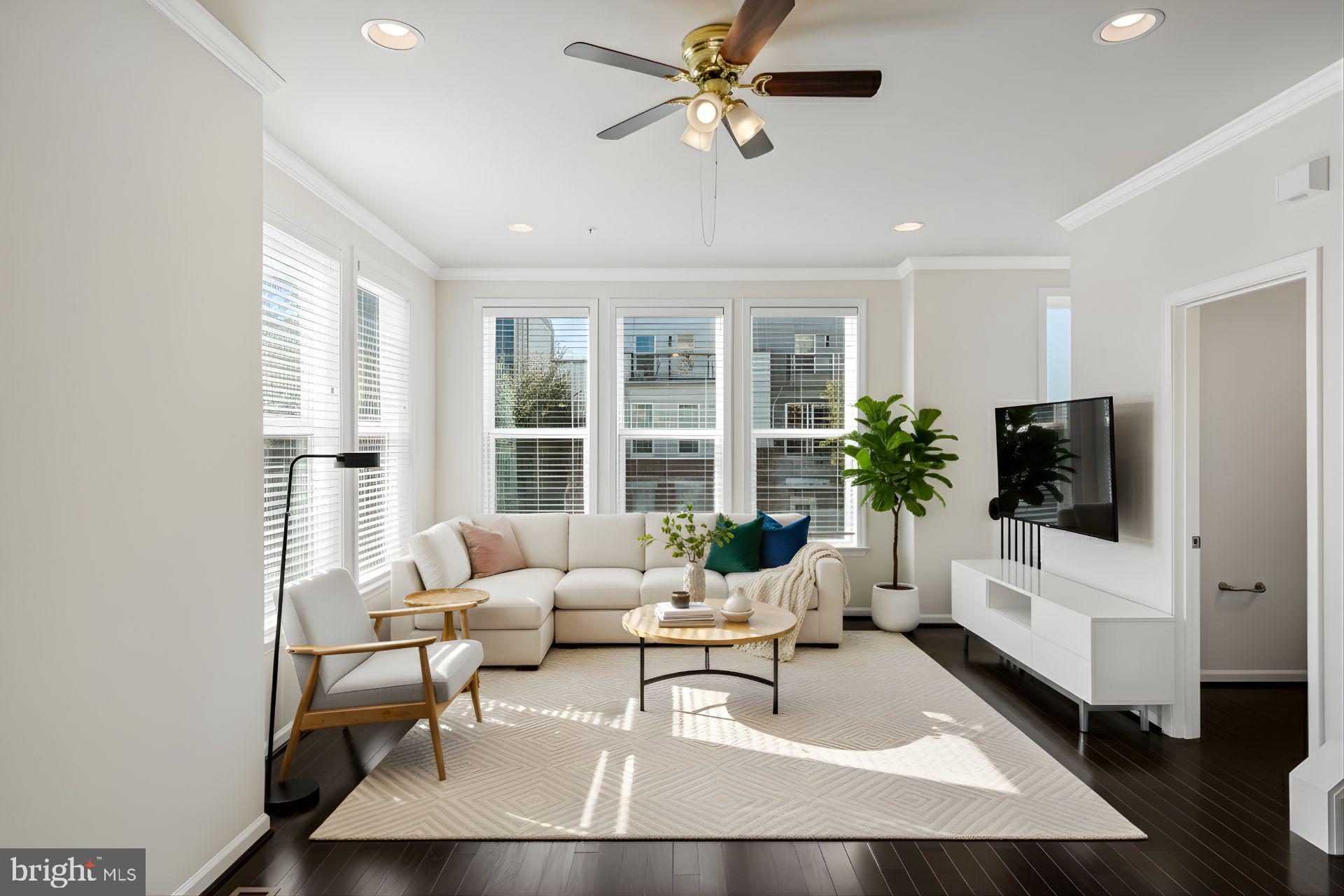 14580 Lakestone Drive Chantilly, VA 20151 - Photo 3 of 21 a living room with furniture and a flat screen tv
