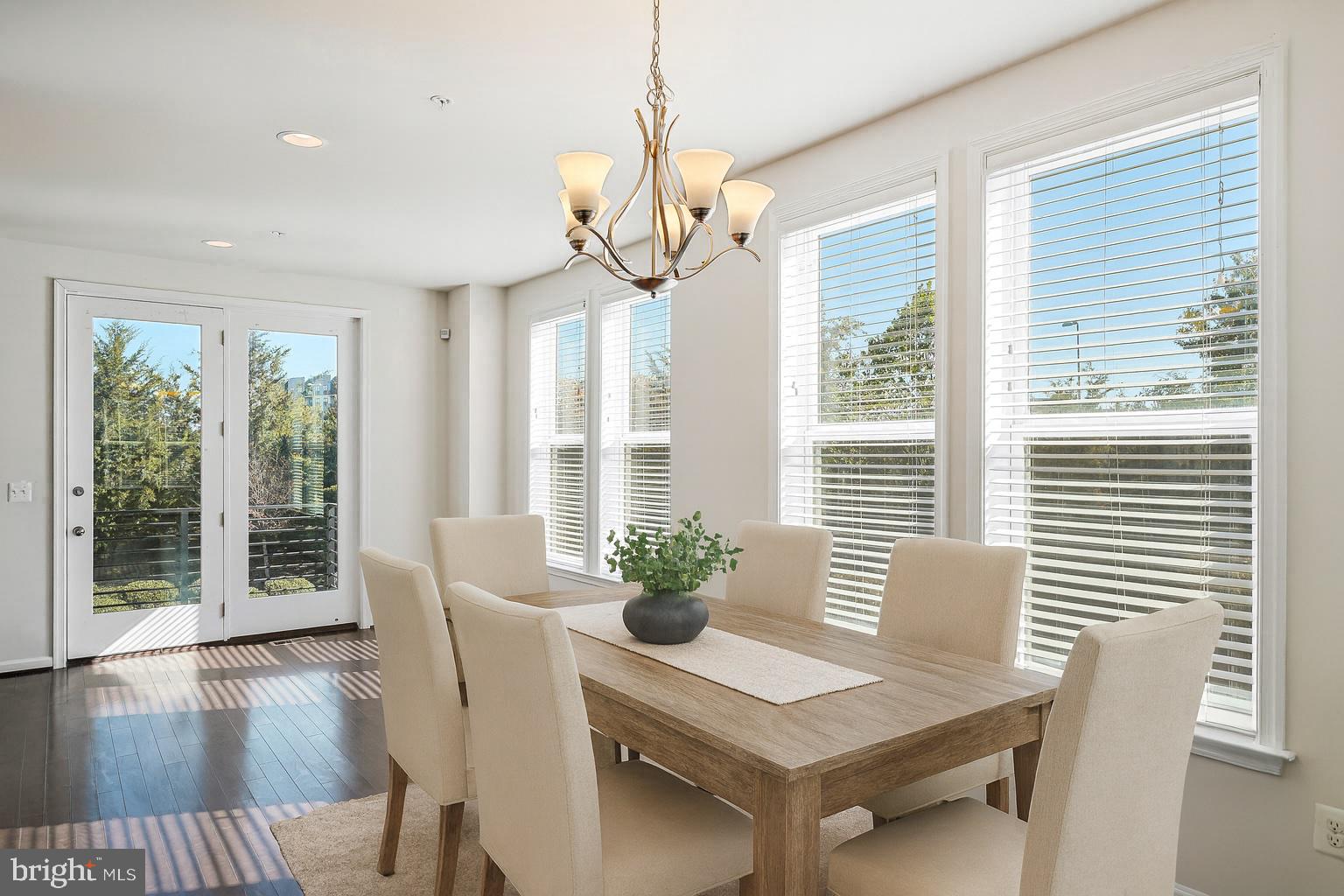 14580 Lakestone Drive Chantilly, VA 20151 - Photo 4 of 21 a view of a dining room with furniture wooden floor and chandelier