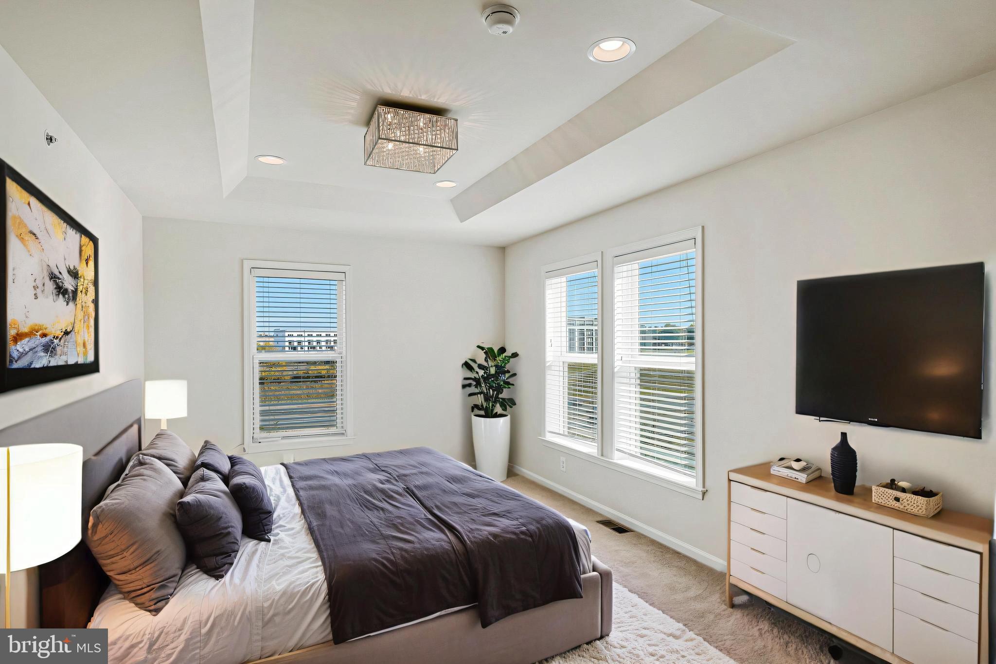 14580 Lakestone Drive Chantilly, VA 20151 - Photo 9 of 21 a bedroom with a bed and a flat screen tv