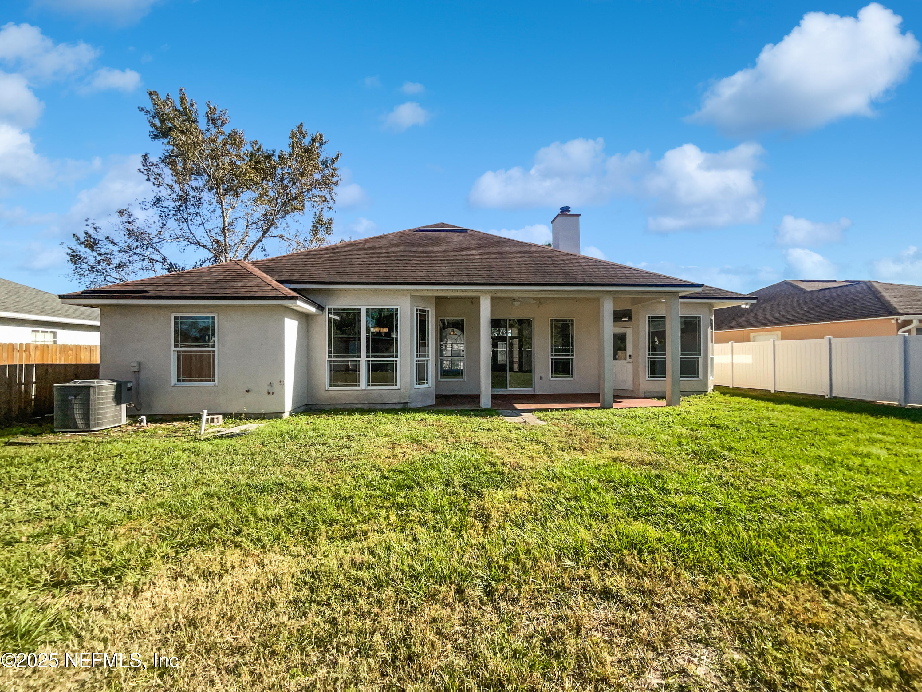 9767 Brockham Court Jacksonville, FL 32221 - Photo 3 of 17 a front view of a house with a garden